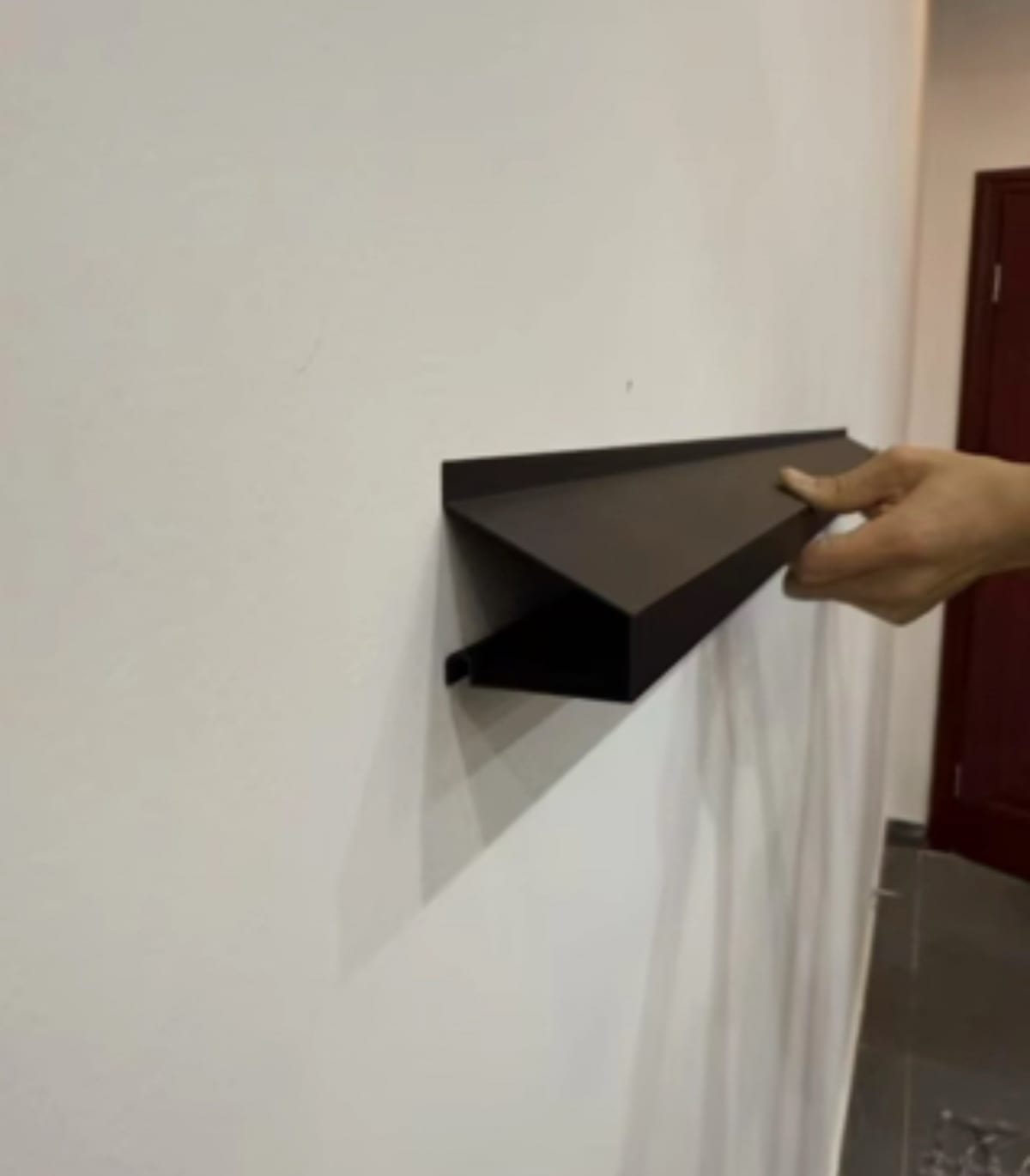 Low-profile exterior lighting track used for clean roofline installation